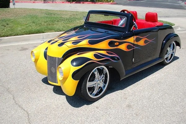 Black 39 Roadster with Yellow Flames affordable golf cart rental, golf cart rent lehigh acres