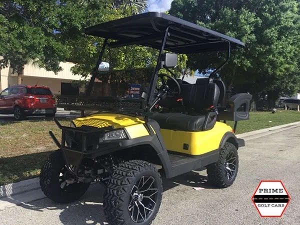 Yellow Aluma 4 Passenger Lifted Golf Cart affordable golf cart rental, golf cart rent lehigh acres